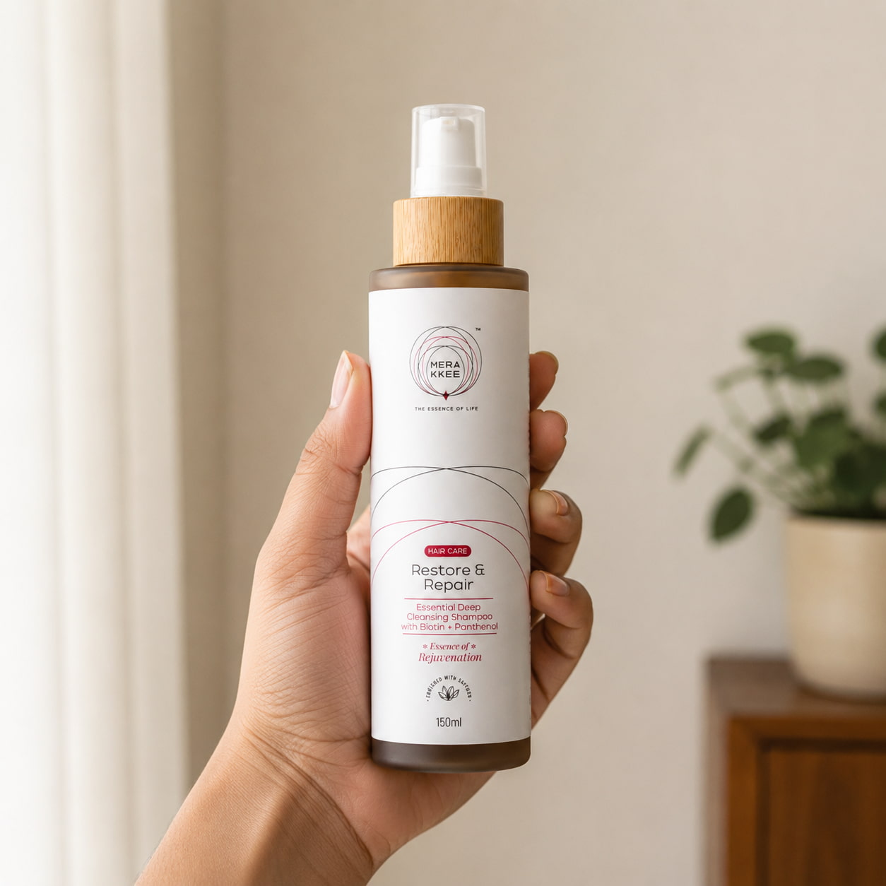 MERAKKEE Essential Hair Deep Cleansing Shampoo 150ml — pump bottle held in hand size reference — Restore & Repair Rejuvenation