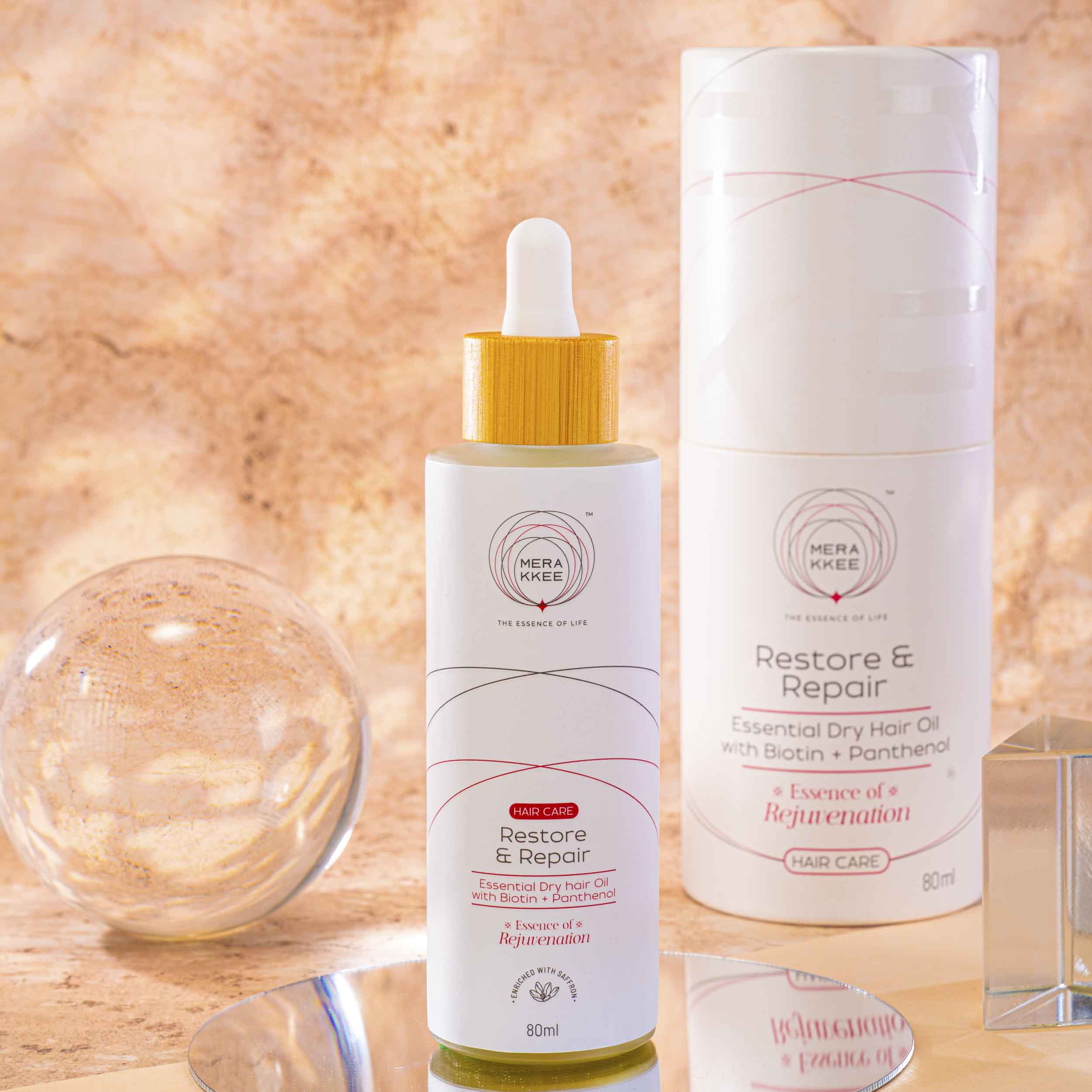 MERAKKEE Essential Dry Hair Oil — outer carton and dropper bottle complete package — gift-ready premium hair care India