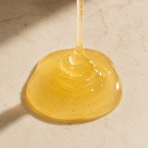 MERAKKEE Radiance 24K Face Wash — foam gel texture swatch on white — 24K Gold Almond Oil Polyglutamic Acid formula