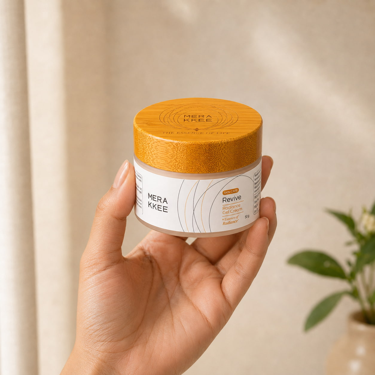 MERAKKEE Radiance Gel Cream 50g — glass jar held in hand size reference — Revive Essence of Radiance India
